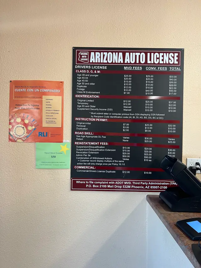 The fee schedule posted on the wall of the Tucson office.