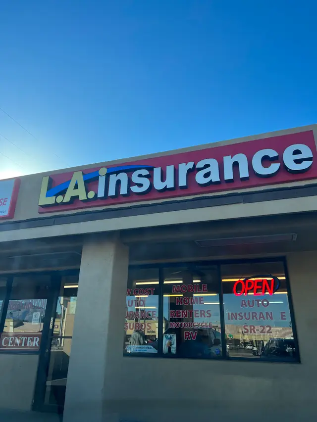 The office window in Tucson, lettered open for registration and title work.